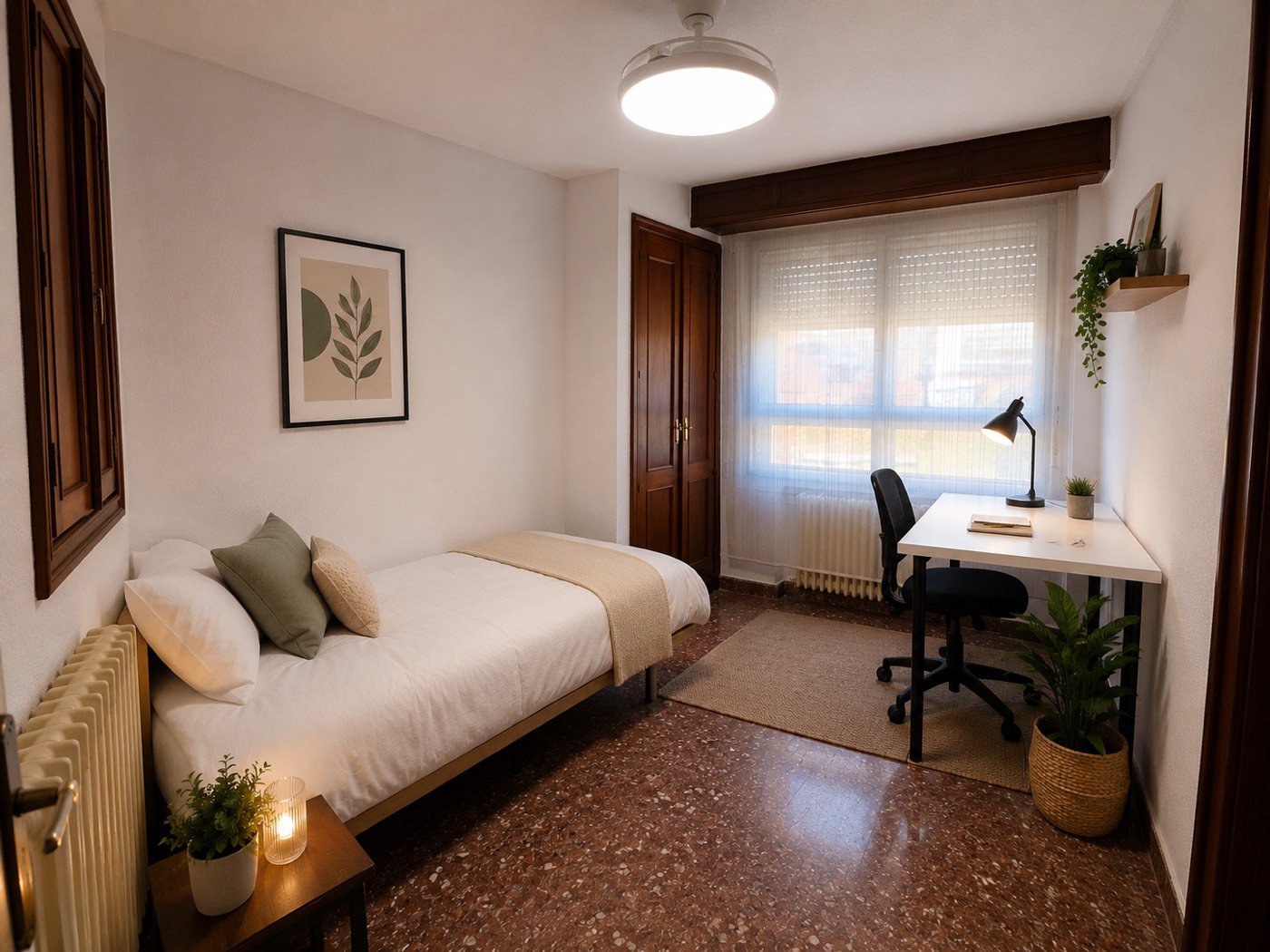 Habitación individual con cama vestida, armario de madera y zona de estudio